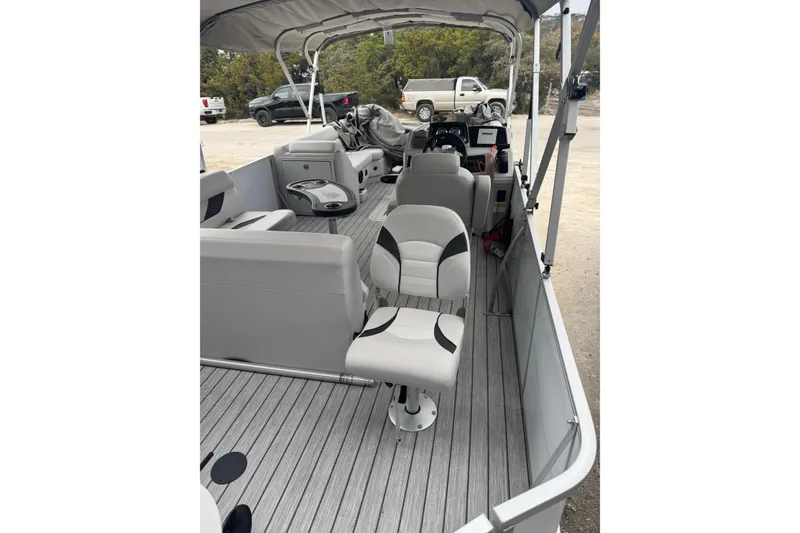 Slide: The Image of 2022 G3 Suncatcher Select 322RF pontoon boat interior with seating and helm. - 12