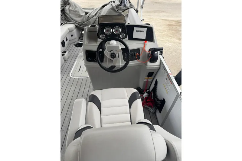 Slide: The Image of Interior of 2022 G3 Suncatcher Select 322RF boat with steering console and seating. - 14