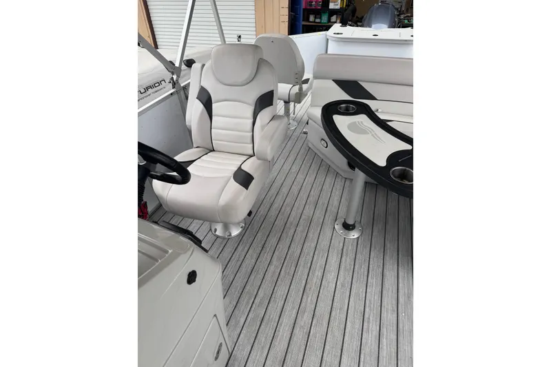 Slide: The Image of 2022 G3 Suncatcher Select 322RF boat interior with plush seating and sleek design. - 16