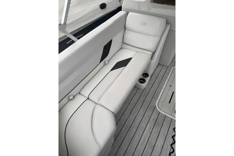 Slide: The Image of 2022 G3 Suncatcher Select 322RF boat interior with white seating and cup holders. - 17