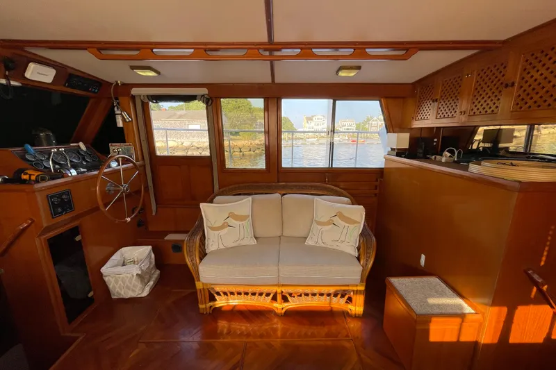 Slide: The Image of Interior of 1987 Heritage East 40 Sundeck yacht with wooden decor and cozy seating. - 12