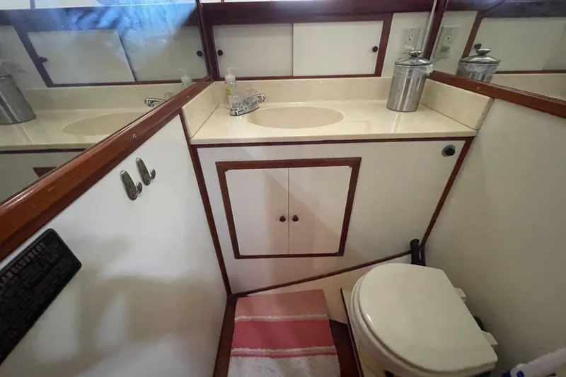 Slide: The Image of 1987 Heritage East 40 Sundeck bathroom with sink, mirror, and toilet. - 18