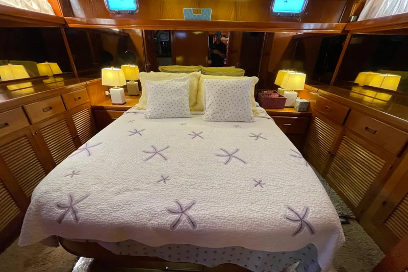Slide: The Image of Luxurious bedroom interior of 1987 Heritage East 40 Sundeck yacht with starfish-themed bedding. - 20