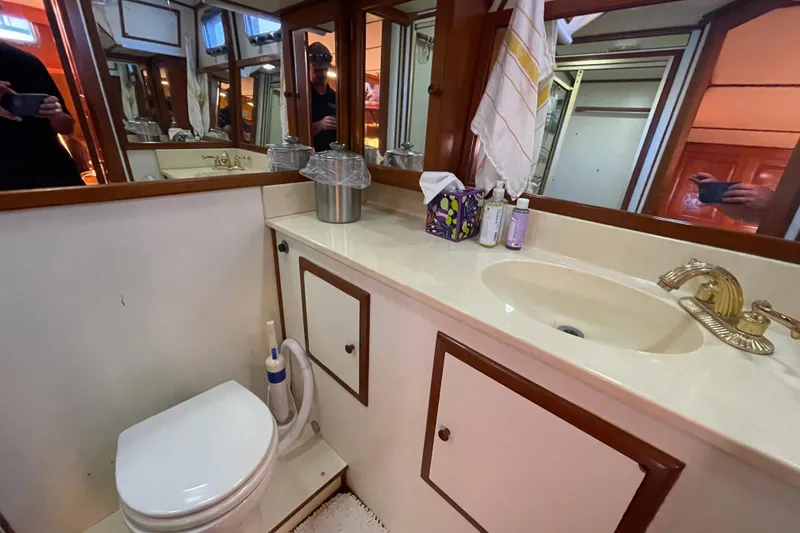 Slide: The Image of 1987 Heritage East 40 Sundeck bathroom with sink, toilet, and mirror. - 22