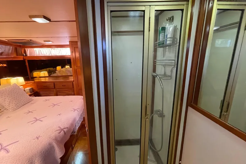 Slide: The Image of 1987 Heritage East 40 Sundeck interior with bedroom and shower area. - 23