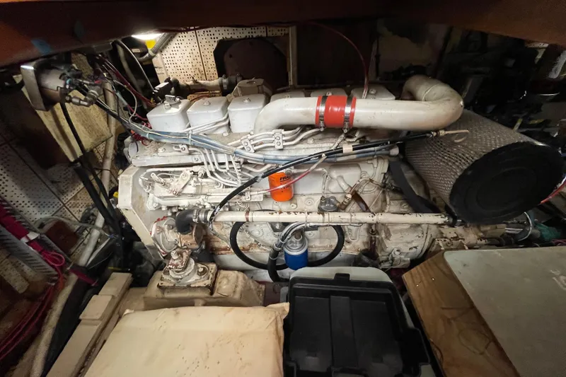 Slide: The Image of Engine room of a 1987 Heritage East 40 Sundeck boat, showcasing detailed machinery. - 25