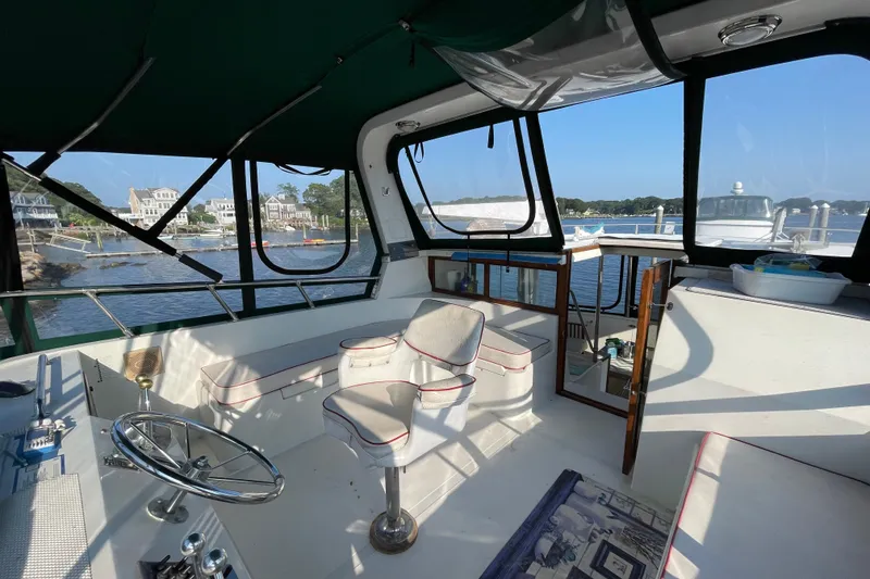 Slide: The Image of 1987 Heritage East 40 Sundeck interior with scenic waterfront view. - 9