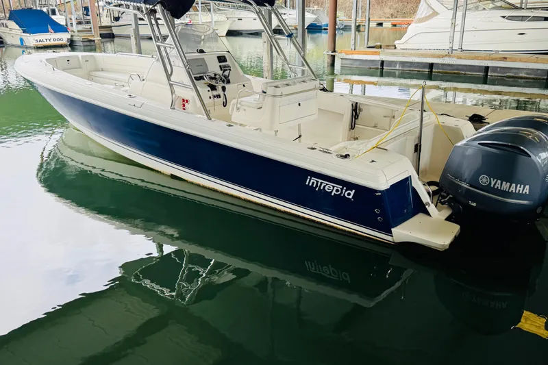 The Image of 2008 Intrepid 327 boat with Yamaha engines docked in a marina. - 0