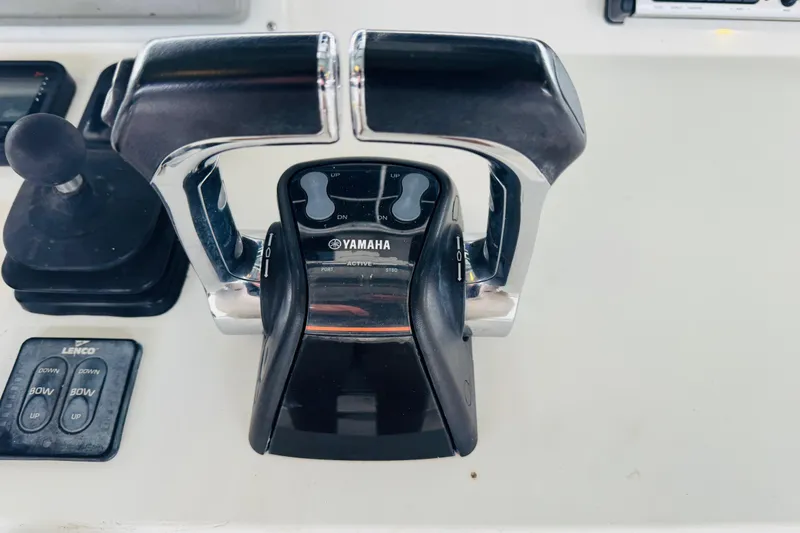 Slide: The Image of Yamaha throttle controls on a 2008 Intrepid 327 boat dashboard. - 15