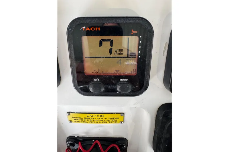 Slide: The Image of Yamaha tachometer display on 2008 Intrepid 327 boat, showing RPM and caution label. - 12