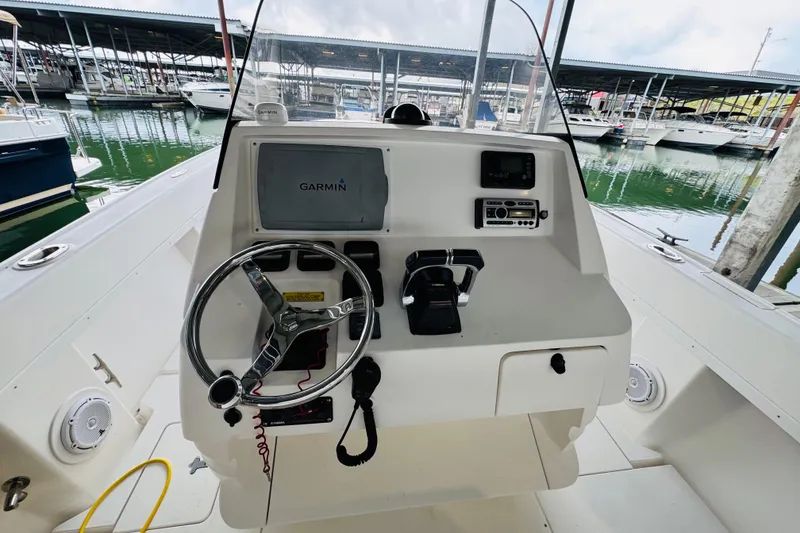 Slide: The Image of 2008 Intrepid 327 boat helm with Garmin navigation system at marina. - 13