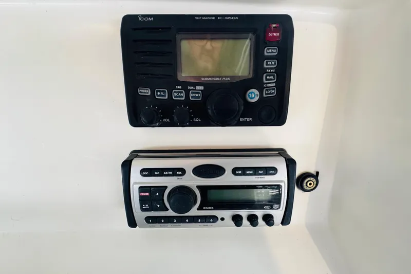 Slide: The Image of VHF marine radio and audio system on 2008 Intrepid 327 boat dashboard. - 14