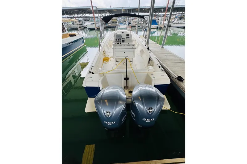 Slide: The Image of 2008 Intrepid 327 boat with dual Yamaha 350 engines docked at marina. - 26