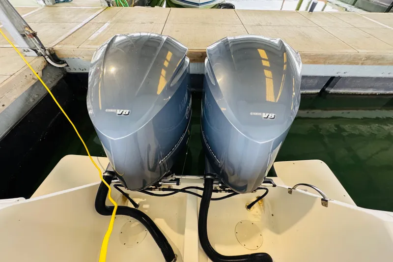 Slide: The Image of Twin Yamaha V8 engines on a 2008 Intrepid 327 boat at dock. - 27