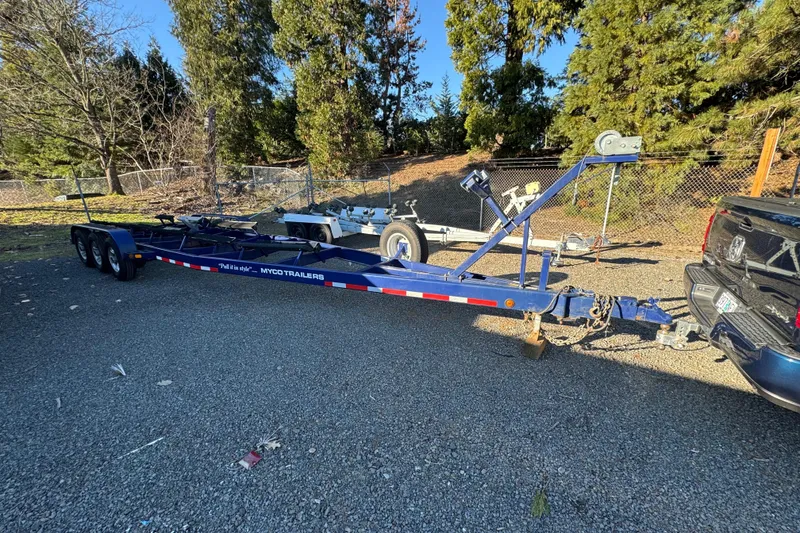 Slide: The Image of Blue Myco trailer for 2008 Intrepid 327, parked outdoors near trees. - 28