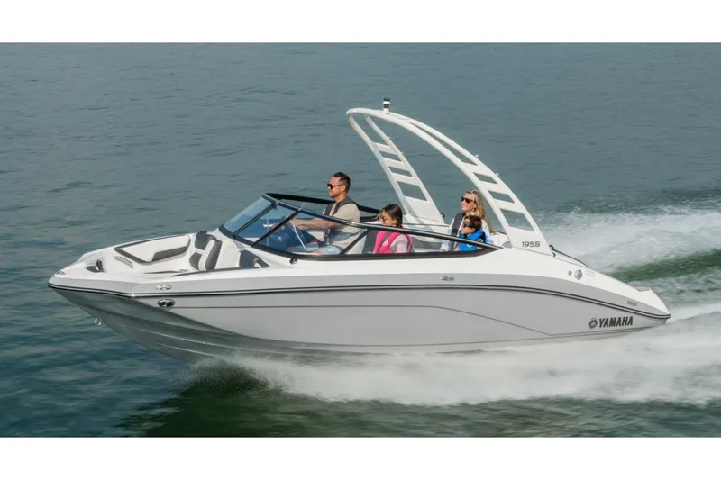 The Image of 2026 Yamaha Boats 195S cruising on water with passengers enjoying the ride. - 1