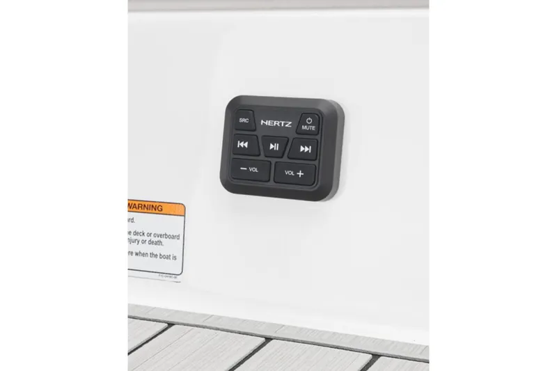 Slide: The Image of Control panel on 2026 Yamaha Boats 195S, featuring audio controls and warning label. - 7