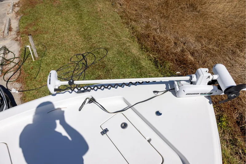 Slide: The Image of 2016 Sea Hunt BX 24 BR boat with Minn Kota trolling motor on deck. - 11