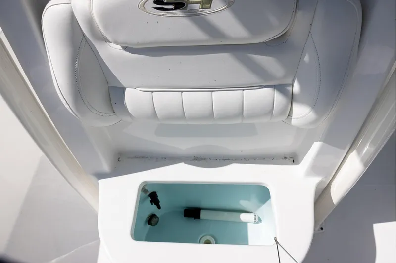 Slide: The Image of 2016 Sea Hunt BX 24 BR boat seat with built-in storage compartment. - 13