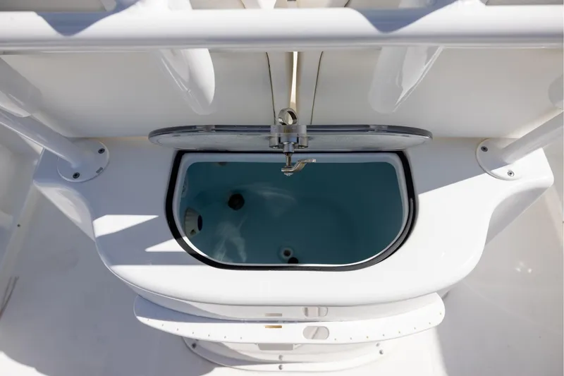 Slide: The Image of 2016 Sea Hunt BX 24 BR boat livewell with open lid and faucet. - 17