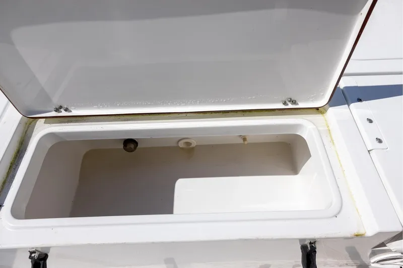 Slide: The Image of Open storage compartment on 2016 Sea Hunt BX 24 BR boat. - 18