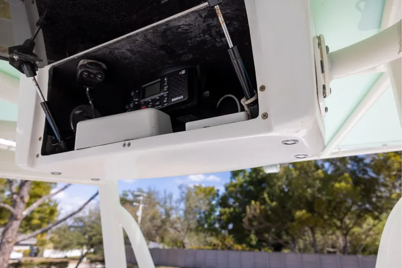 Slide: The Image of 2016 Sea Hunt BX 24 BR boat electronics compartment with Simrad equipment. - 8