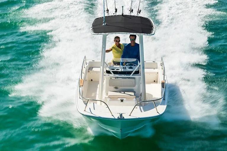 Slide: The Image of Manufacturer Provided Image: 2022 Boston Whaler 190 Montauk boat cruising on clear blue water. - 4