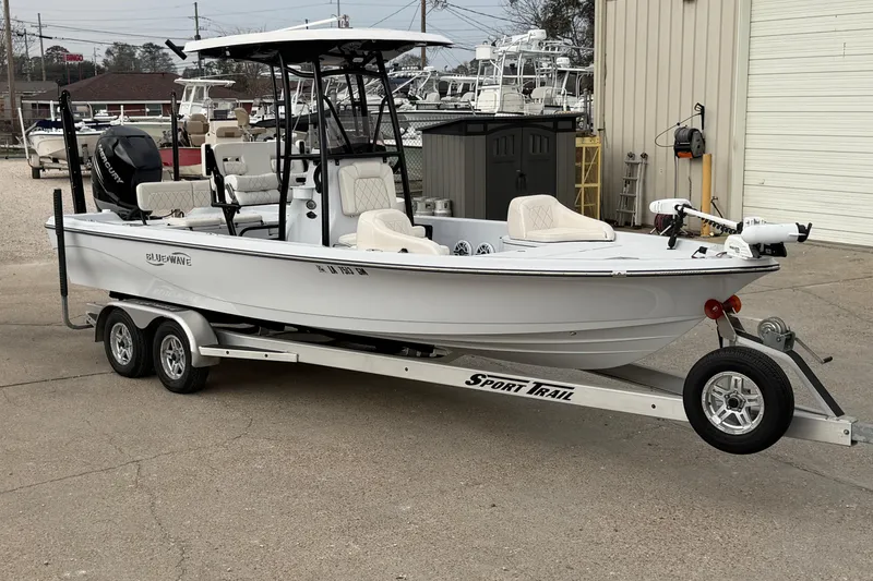 The Image of 2021 Blue Wave 2400 PureBay boat on Sport Trail trailer, parked outdoors. - 12