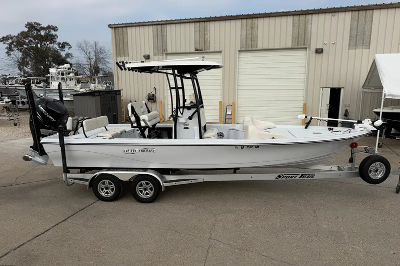 Slide: The Image of Open storage compartment on a 2021 Blue Wave 2400 PureBay boat deck. - 13