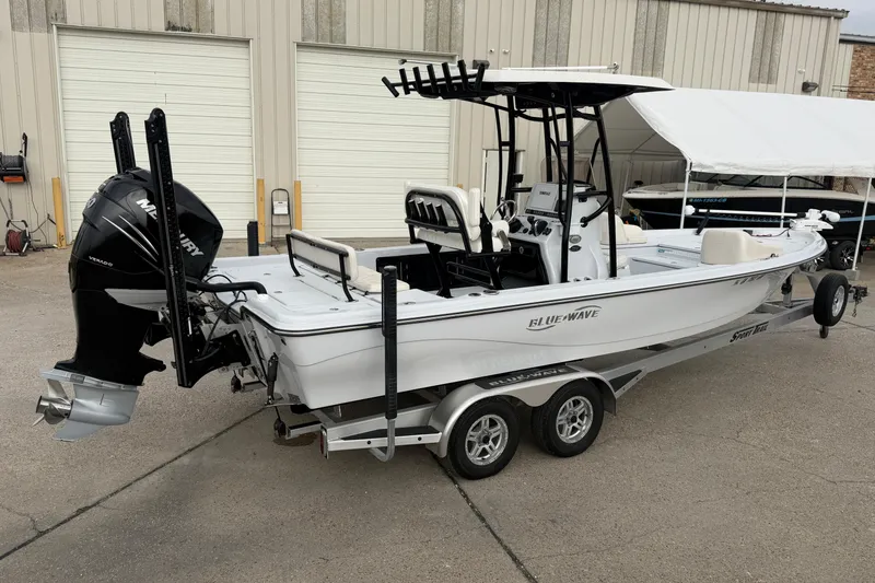 Slide: The Image of Open storage compartment on 2021 Blue Wave 2400 PureBay boat. - 14