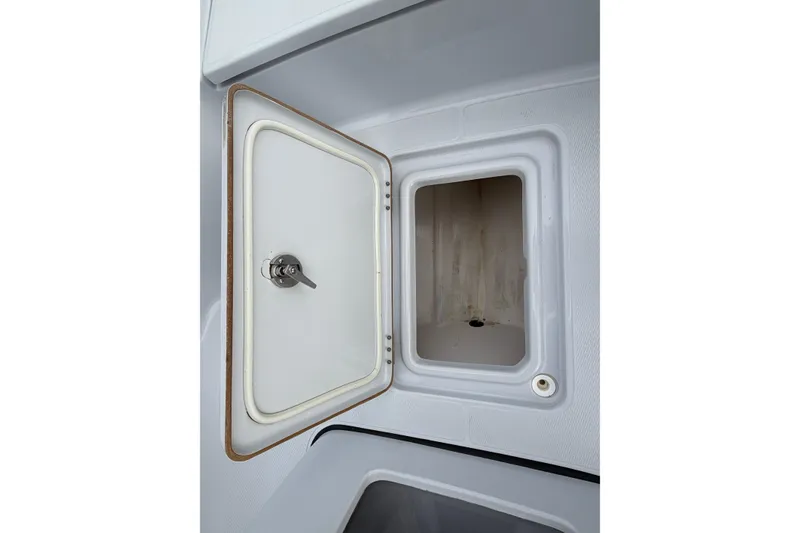Slide: The Image of 2021 Blue Wave 2400 PureBay boat storage compartment, white interior, top view. - 26