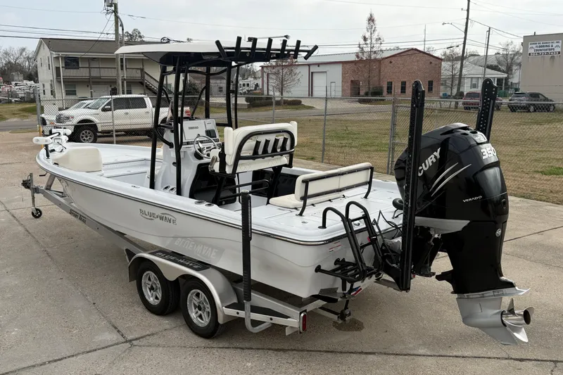Slide: The Image of 2021 Blue Wave 2400 PureBay boat on trailer with Mercury 350 Verado engine. - 4