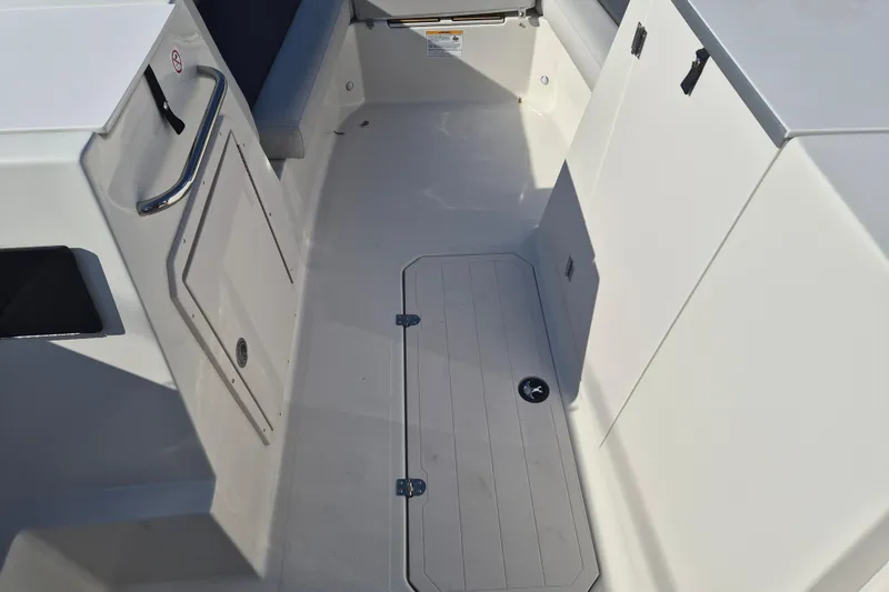 Slide: The Image of 2026 Starcraft SVX 231 OB DH boat interior with cushioned seating and modern design. - 10