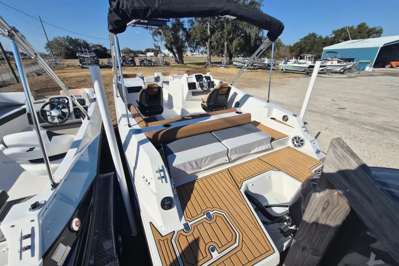 Slide: The Image of 2026 Starcraft SVX 231 OB DH boat interior with seating, steering wheel, and modern design. - 4