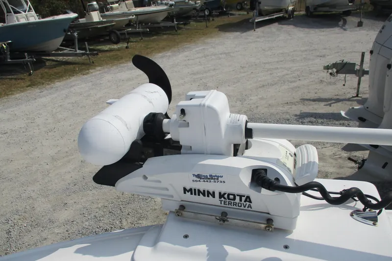 Slide: The Image of Minn Kota Terrova trolling motor on 2019 Contender 25 Tournament boat, parked on gravel. - 10