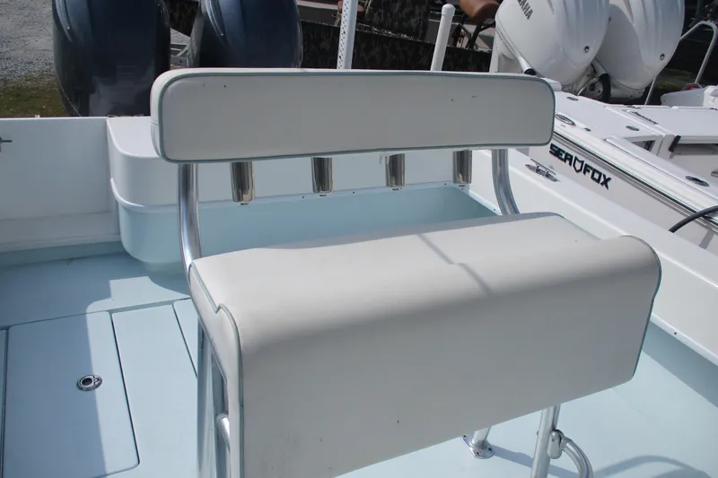 Slide: The Image of 2019 Contender 25 Tournament boat with white seating and rod holders. - 13