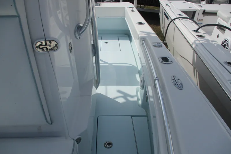 Slide: The Image of 2019 Contender 25 Tournament boat interior with sleek design and stainless steel fittings. - 16