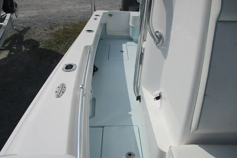 Slide: The Image of 2019 Contender 25 Tournament boat interior with sleek white deck and stainless steel fittings. - 17