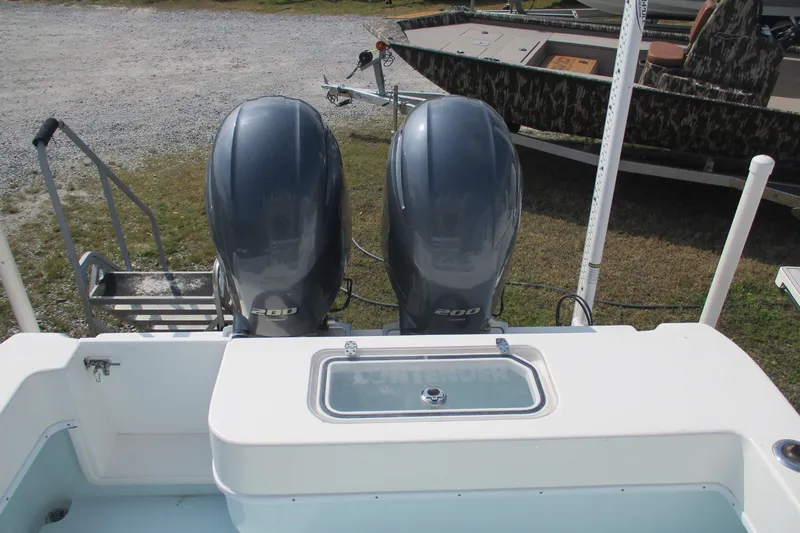 Slide: The Image of 2019 Contender 25 Tournament boat with dual 200 horsepower engines, rear view. - 18