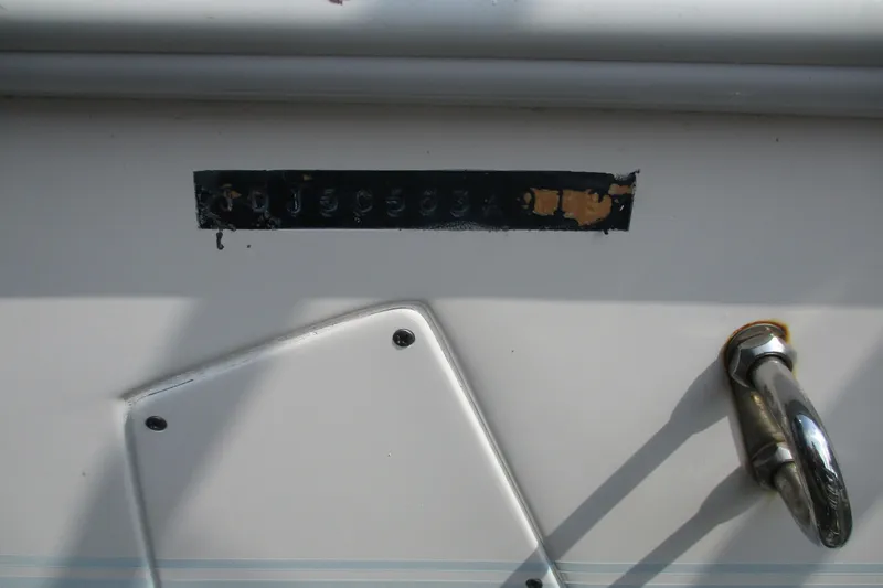 Slide: The Image of 2019 Contender 25 Tournament boat hull identification number and metal fixture. - 20