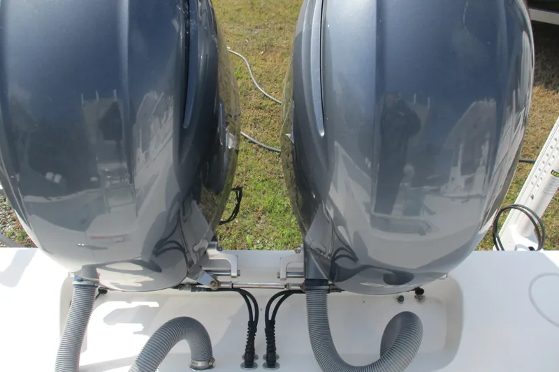 Slide: The Image of Twin outboard motors on a 2019 Contender 25 Tournament boat, viewed from above. - 6