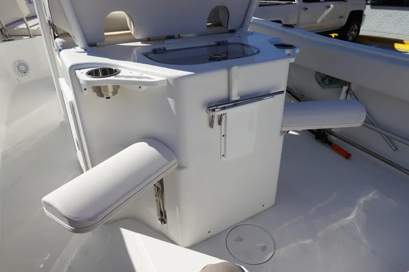 Slide: The Image of 2021 Sea Hunt Ultra 234 boat interior with seating and storage features. - 16