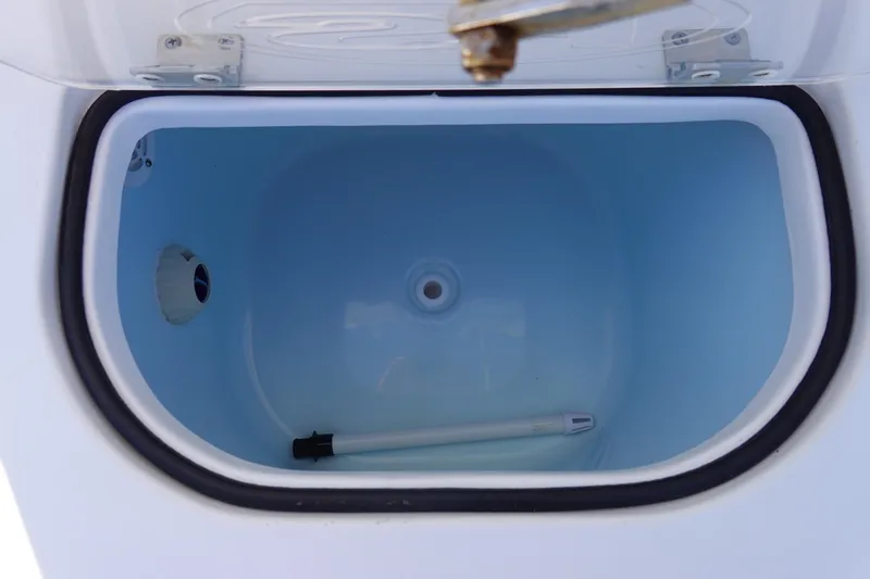 Slide: The Image of Livewell compartment in 2021 Sea Hunt Ultra 234 boat, open lid view. - 17