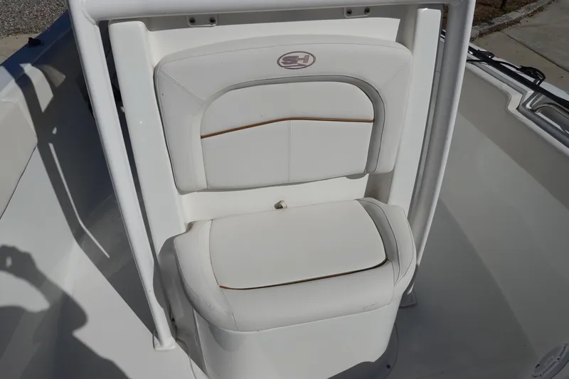 Slide: The Image of White seating on 2021 Sea Hunt Ultra 234 boat, featuring sleek design and comfortable padding. - 25