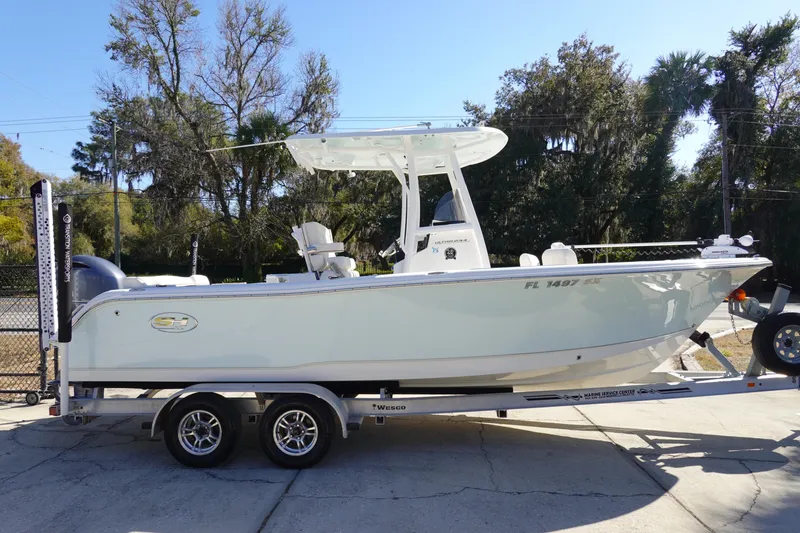 Slide: The Image of 2021 Sea Hunt Ultra 234 boat on trailer, parked outdoors, side view. - 5