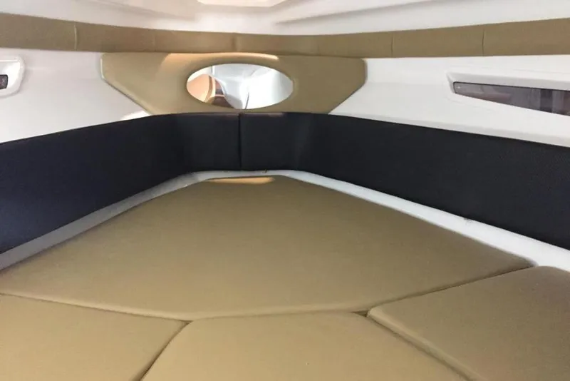Slide: The Image of Interior cabin of 2026 Hanover 305 boat with beige and black seating. - 9