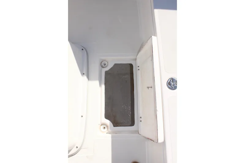 Slide: The Image of Open storage compartment on 2024 Clearwater 2000 CC boat deck. - 13