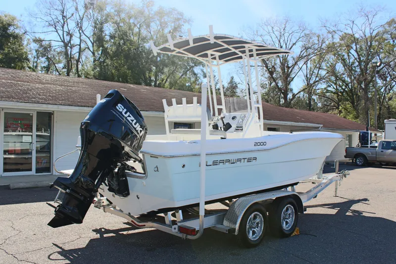 Slide: The Image of 2024 Clearwater 2000 CC boat on trailer with Suzuki outboard motor. - 6
