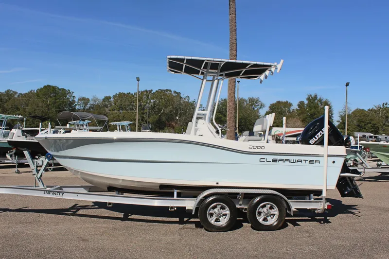 The Image of 2024 Clearwater 2000 CC boat on trailer, side view, outdoors. - 1