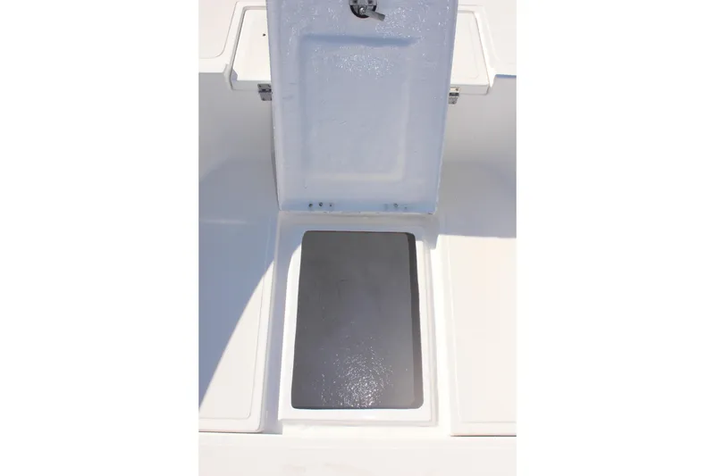 Slide: The Image of Open storage compartment on 2024 Clearwater 2000 CC boat deck. - 15